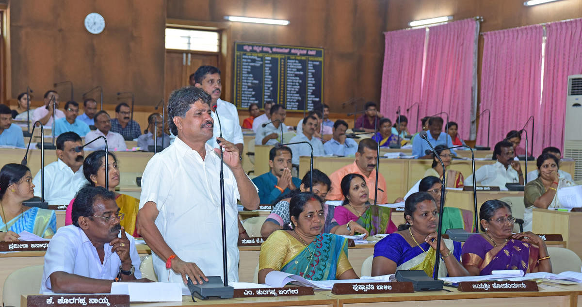 A member raises a point in the Zilla Panchayat meeting in Mangaluru on Saturday.