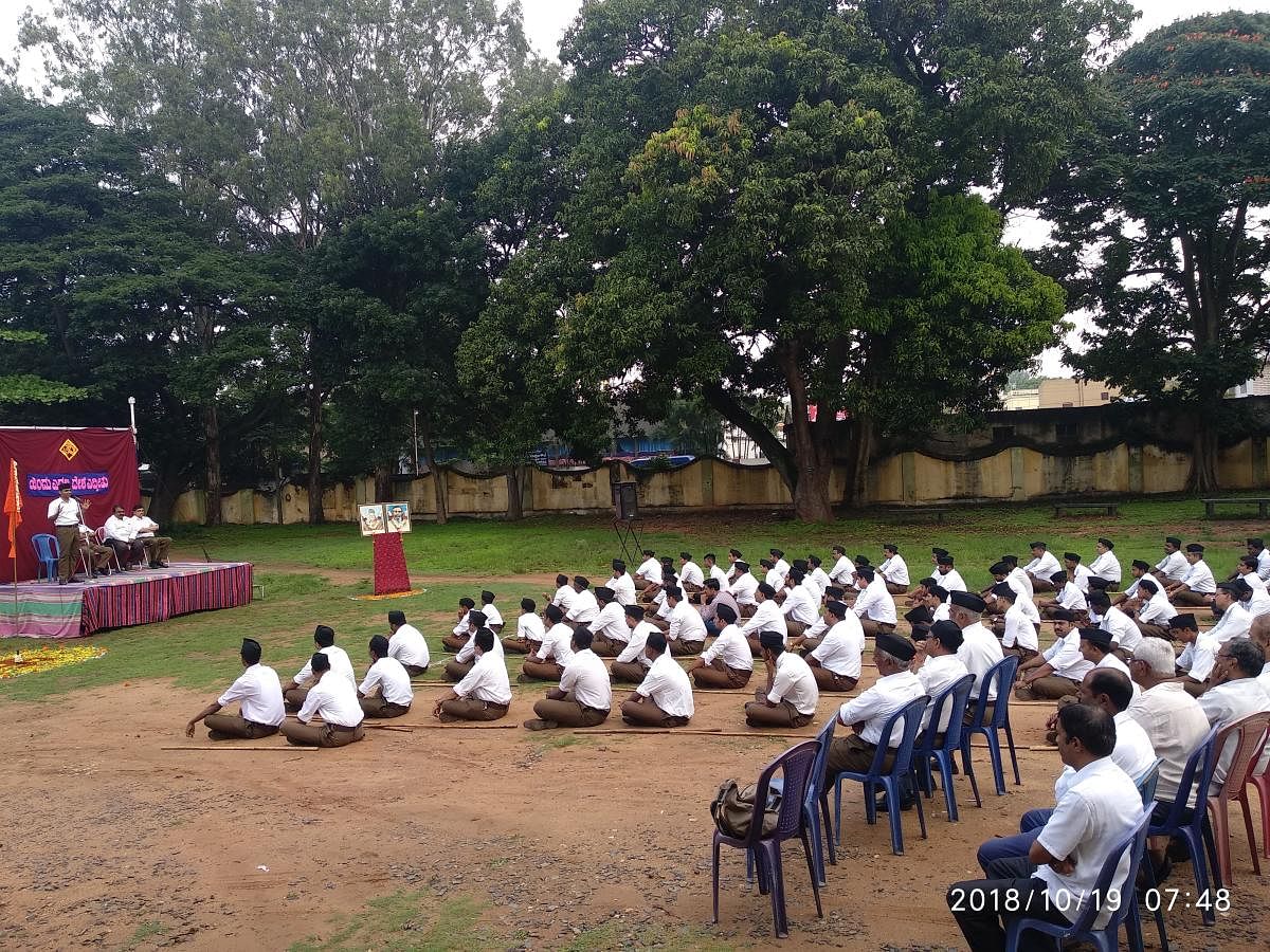 RSS volunteers take part in the Boudhik, held as part of Vijayadashami, at Vani Vilas College, in Nazarbad, Mysuru, recently.