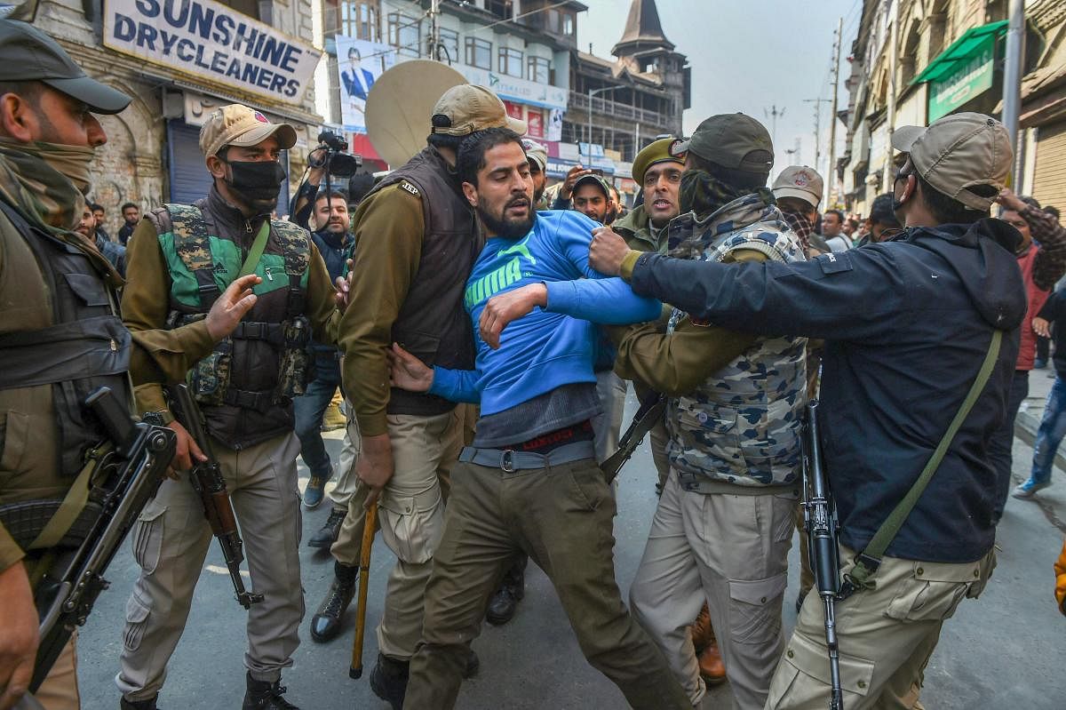 Police take away supporters of senior separatist leader Mohammad Yasin Malik during a protest march over the death of 7 civilians in a blast at an encounter site in Laroo area of Kulgam district of south Kashmir, at Kokar Bazar in Srinagar on Tuesday. PTI