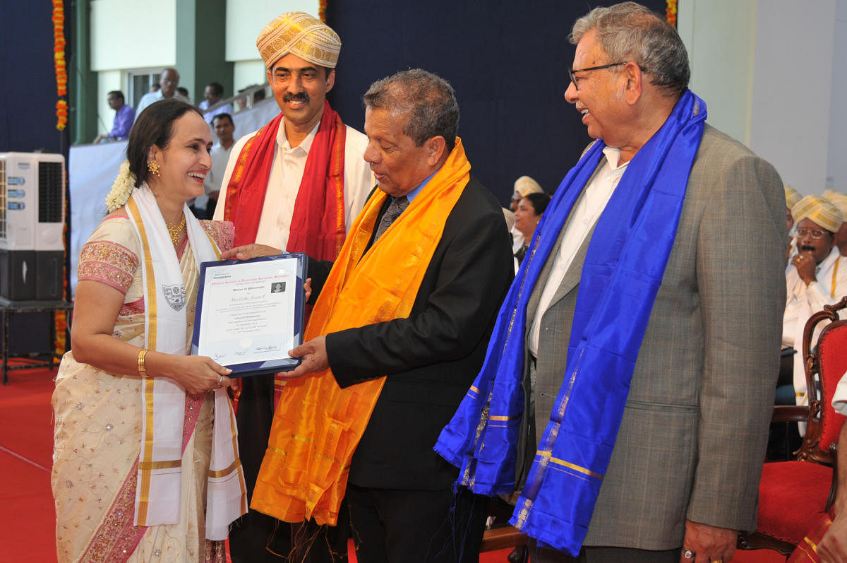 Ushaprabha N Nayak, Vice-Chairperson of Expert Group of Institutions, receives PhD degree from Nitte Deemed to be University Chancellor N Vinay Hegde, during NITK convocation on Saturday.