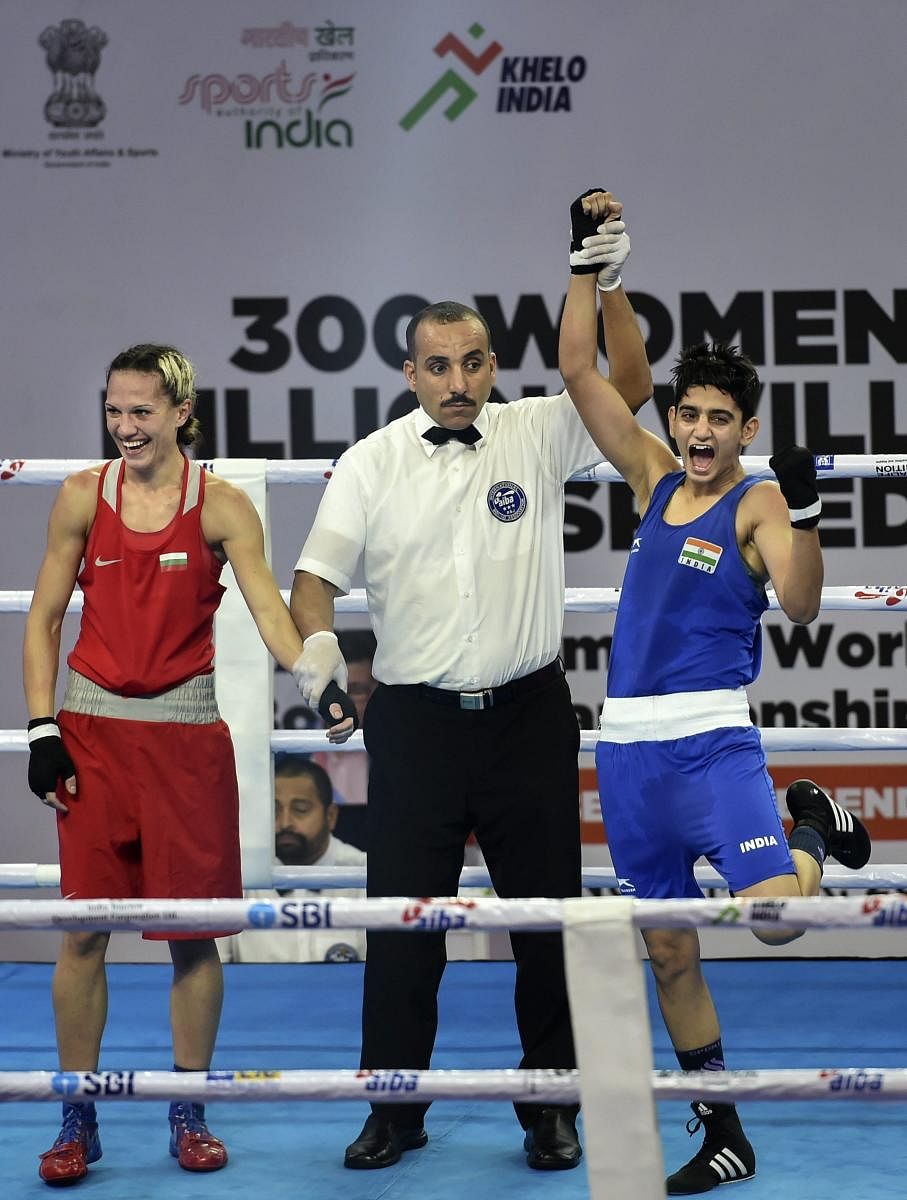 India’s Sonia Chahal is declared winner against Bulgarian Stanimira Petrova (left) in the women's light flyweight 57 kg category of the AIBA Women's World Boxing Championships in New Delhi on Monday.