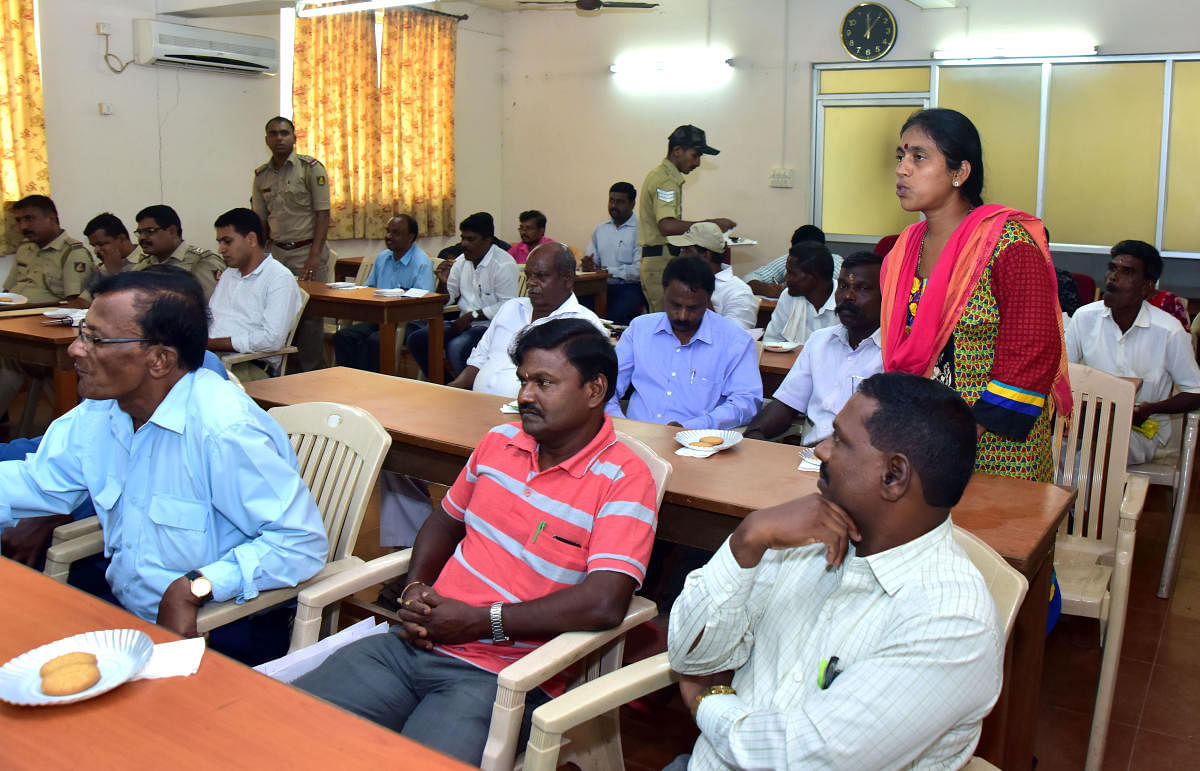 A woman raises a point during the SC/ST grievances meeting organised under the chairmanship of Superintendent of Police Dr Ravikanthe Gowda.