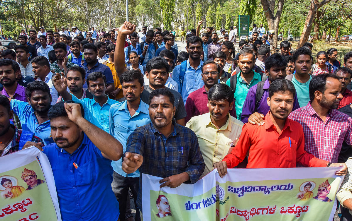 Thousands of BU students and faculty members on Tuesday protested against the KPSC decision to stop SC/ST/OBC candidates to get recruited under the general merit quota.
