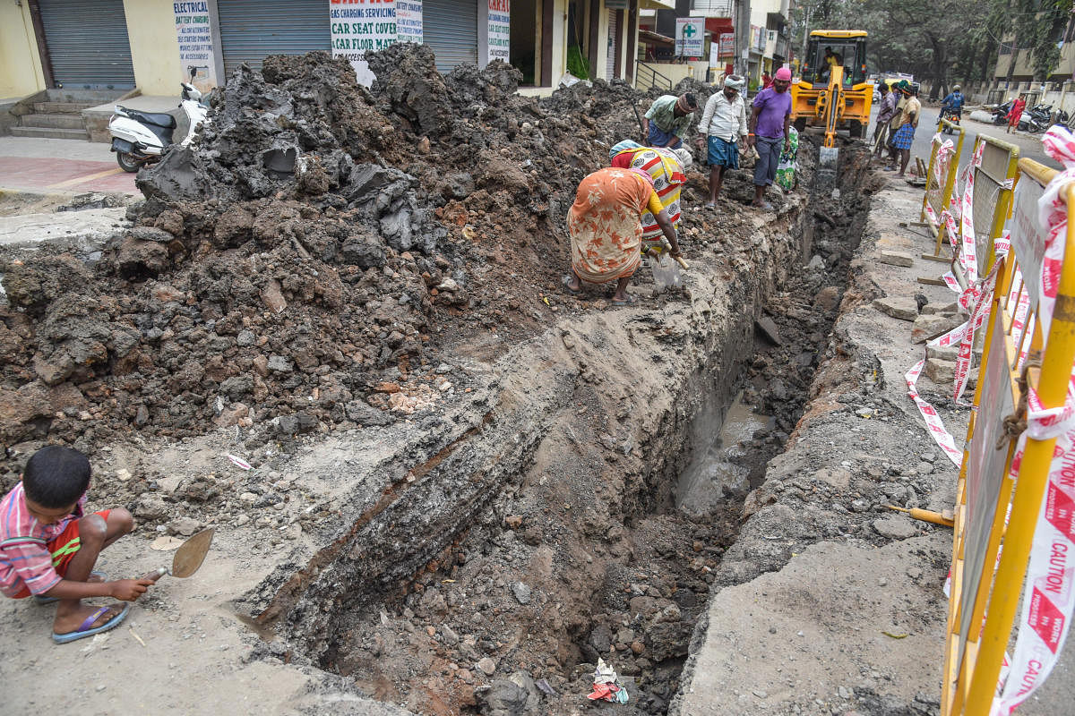 While the BWSSB is laying new sanitary pipelines along the BTS road in Hombegowda Nagar, the BBMP is to begin the white-topping project next week. DH PHOTO/S K Dinesh