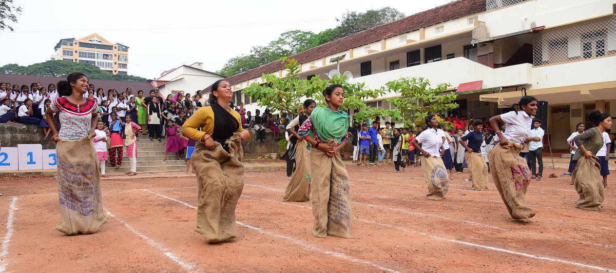 Children take part in a sack race at the Orphanage Olympics held at Canara High School Urva in Mangaluru.
