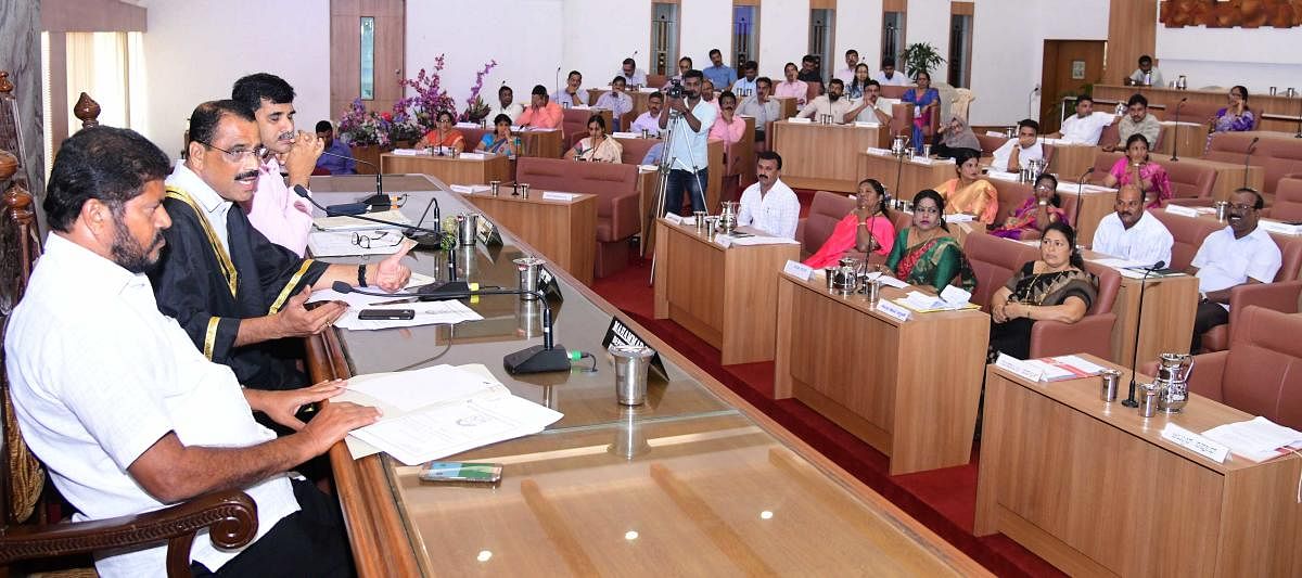 Mayor K Bhaskar Moily addressing the monthly meeting of the Mangaluru City Corporation in the city on Tuesday.