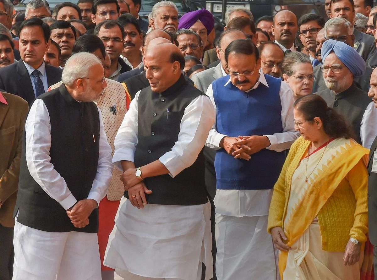 PM Modi, Home Minister Rajnath Singh, Vice President M Venkaiah Naidu, former PM Manmohan Singh, Lok Sabha Speaker Sumitra Mahajan and other dignitaries at a ceremony to pay tribute to the martyrs of 2001 Parliament attack on its 17th anniversary, at Parliament in New Delhi, Thursday. PTI Photo