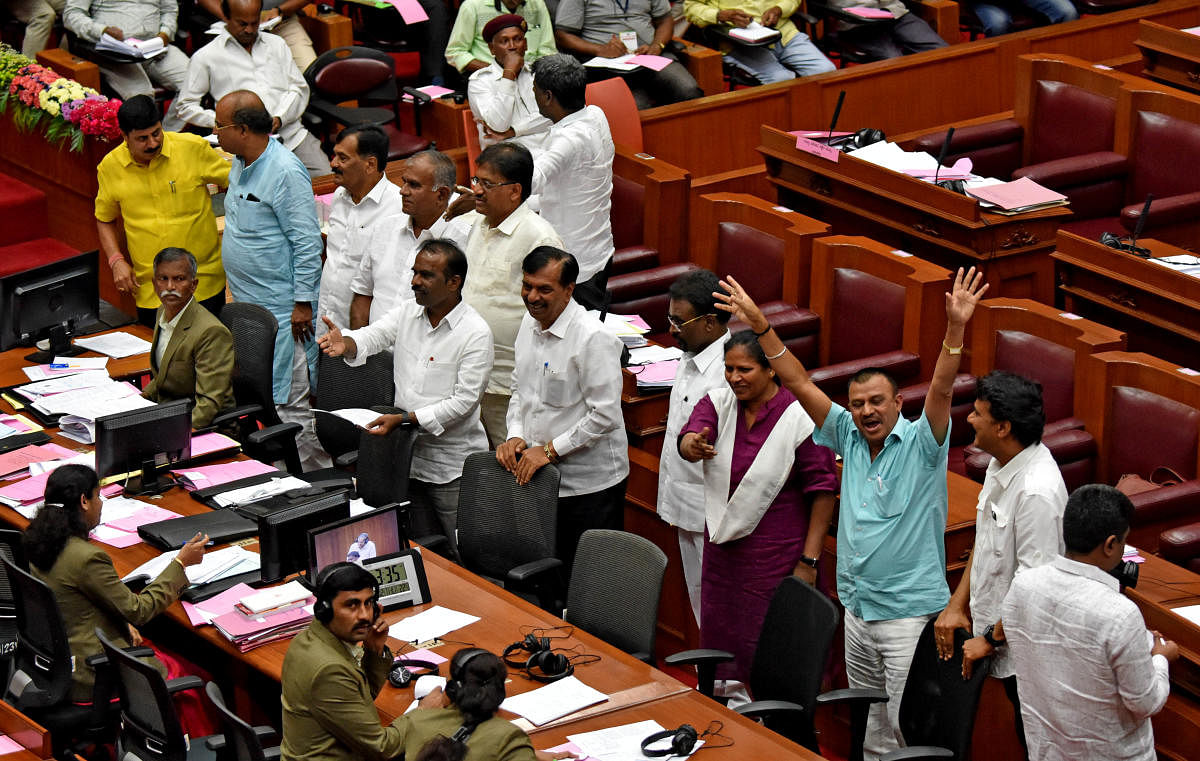 Opposition Leader in the Legislative Council Kota Srinivas Poojary and other BJP members trooped into the well of the House to register their protest for not allowing a discussion on the Tipu Jayanti issue during the winter session at the Suvarna V