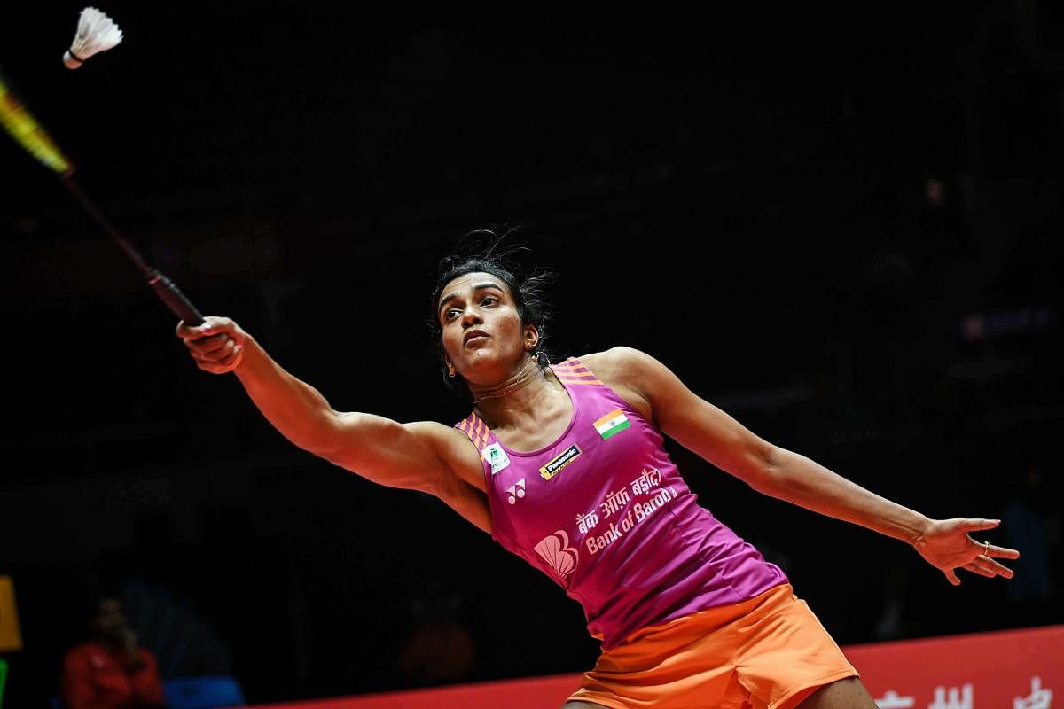 Sindhu Pusarla hits a return against Zhang Beiwen of the US during their women's singles third round match at the 2018 BWF World Tour Finals badminton competition in Guangzhou, in southern China's Guangdong province on December 14, 2018. AFP Photo