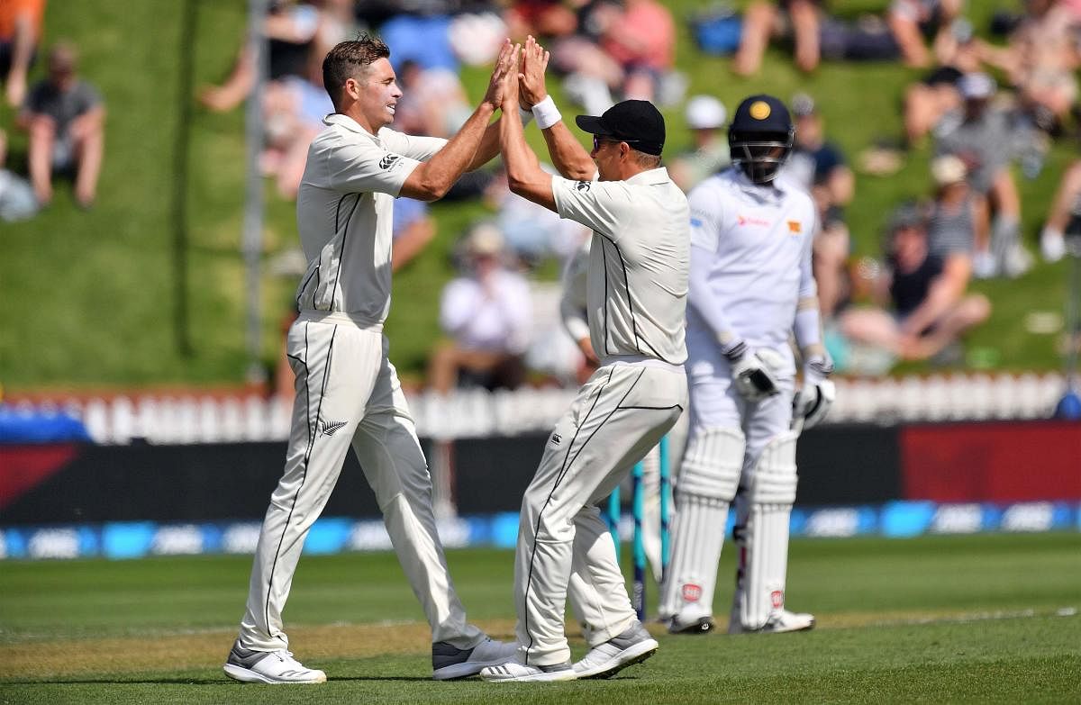 New Zealand's Tim Southee (left) celebrates with team-mates the dismissal of Sri Lanka's Dinesh Chandimal on Saturday. AFP