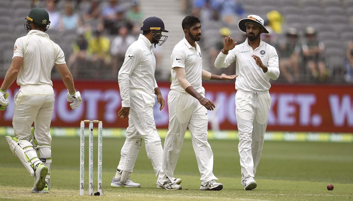 India's Jasprit Bumrah (2nd R) is congratulated by teammates after dismissing Australian batsman Tim Paine (L) during the second day of the second cricket Test match between Australia and India in Perth on December 15, 2018. (AFP Photo)