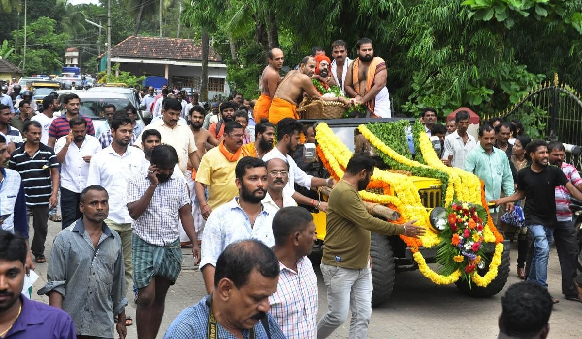 The body of Shiroor seer Lakshmivarateertha Swami is taken out in a procession in Udupi on Thursday. dh photo