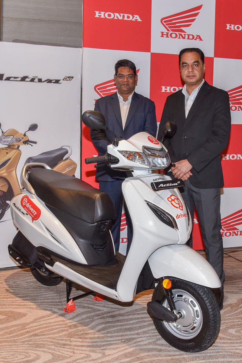 Yogesh Mathur, Head South region, Sales and Yaduvinder Singh Guleria, Senior Vice President, Sales and Marketing, Honda Motorcycle and Scooter India Pvt Ltd are seen at a press conference in Bengaluru on Friday.DH Photo