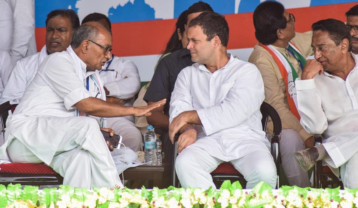 Congress president Rahul Gandhi with senior leader Digvijay Singh and MPCC president Kamal Nath during a public meeting in Satna in Sept. PTI/FILE