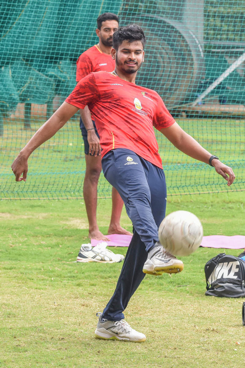 Mumbai captain Shreyas Iyer winds down with a round of football after their practice session, ahead of their final clash against Delhi, in Bengaluru on Friday. DH Photo/ S K Dinesh