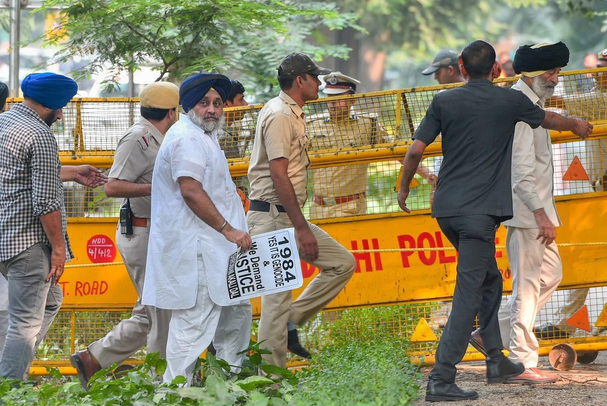 Police Shiromani Akali Dal leader Sukhbir Singh Badal and others who were staging a protest rally demanding justice for the families of those killed in the 1984 anti-Sikh riots, outside 10 Janpath in New Delhi on Saturday. PTI