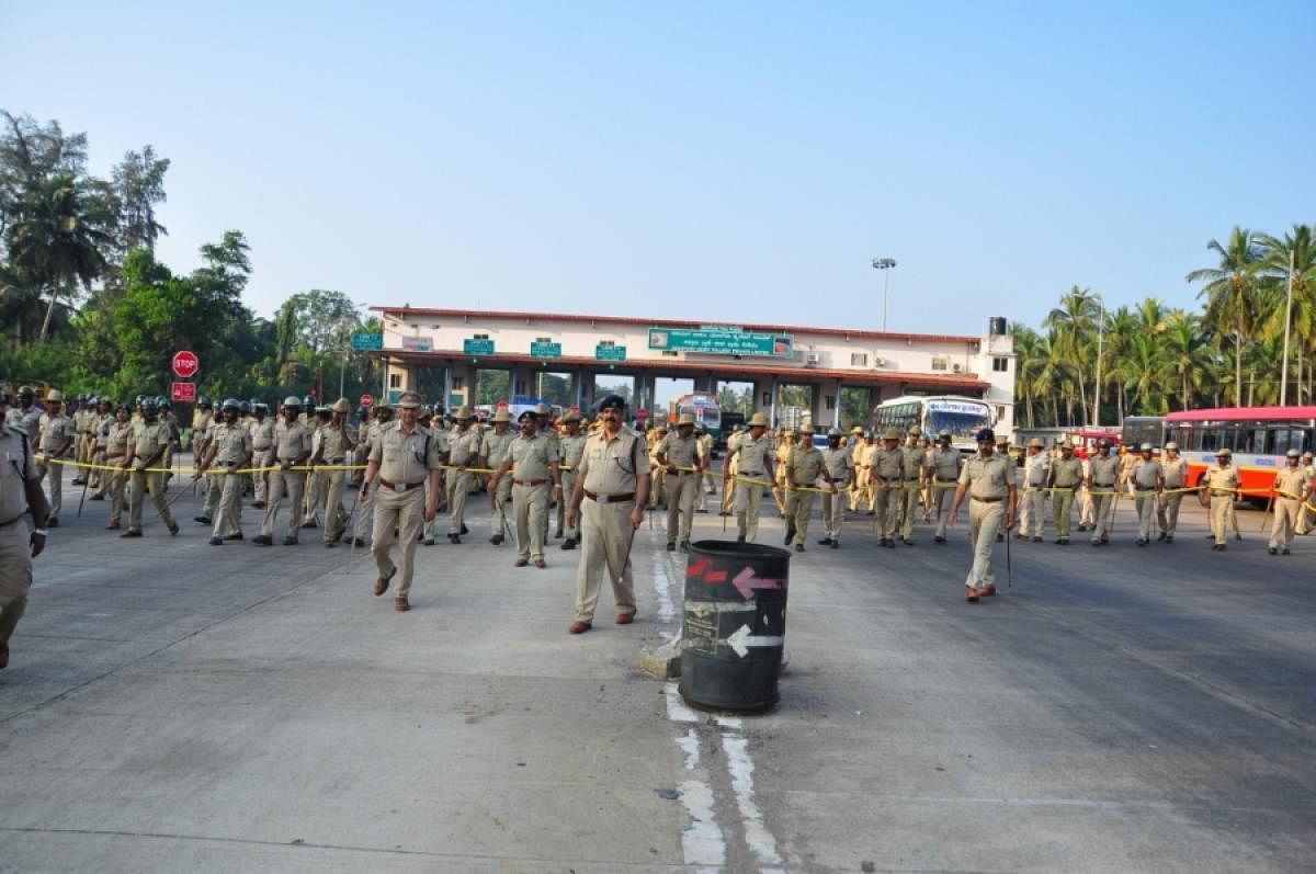 Police personnel deployed at Sasthana tollgate in Udupi district.