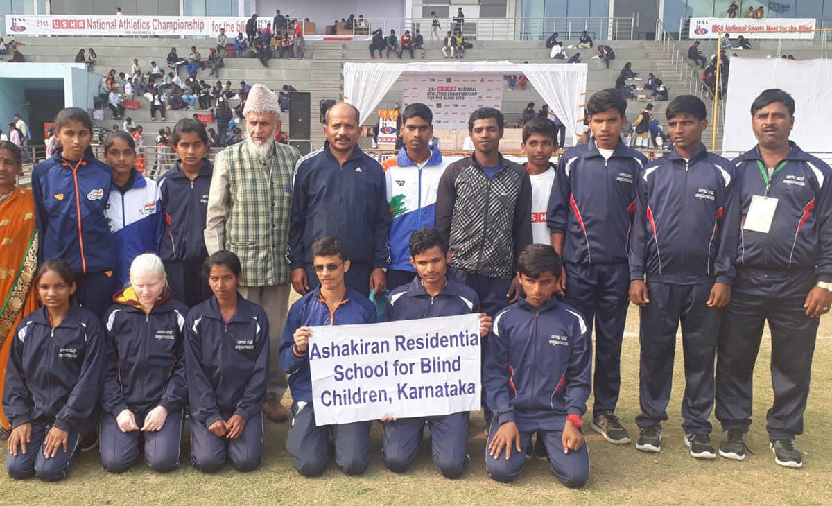 The students of Ashakiran Residential School for Blind Children with their coach.