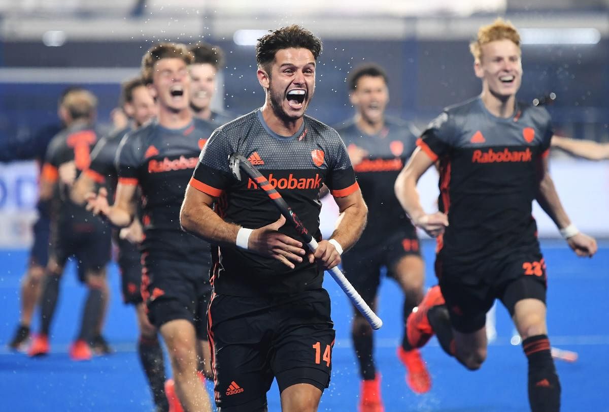 The Netherlands celebrate after their victory over Australia in a pulsating semifinal contest in Bhubaneswar on Saturday. AFP
