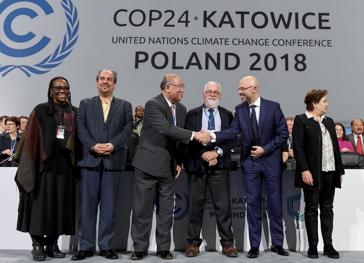 UN climate chief Patricia Espinosa, Iran's head of delegation Majid Shafiepour Motlagh, China's top climate negotiator Xie Zhenhua, European Union's climate commissioner Miguel Arias Canete, COP24 president Michal Kurtyka react at the end of the final ses