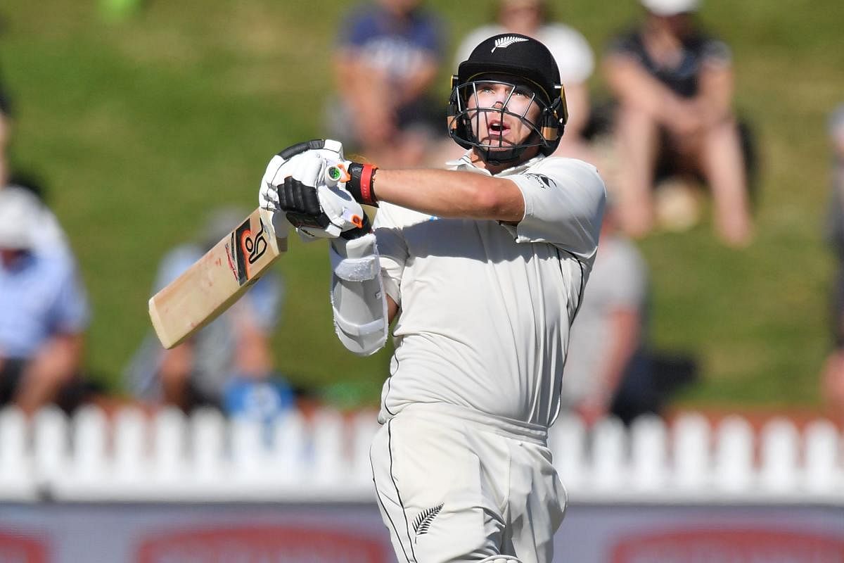 FINE KNOCK: New Zealand's Tom Latham pulls one to the fence en route his unbeaten 121 on the second day of the first Test against Sri Lanka in Wellington on Sunday. AFP 