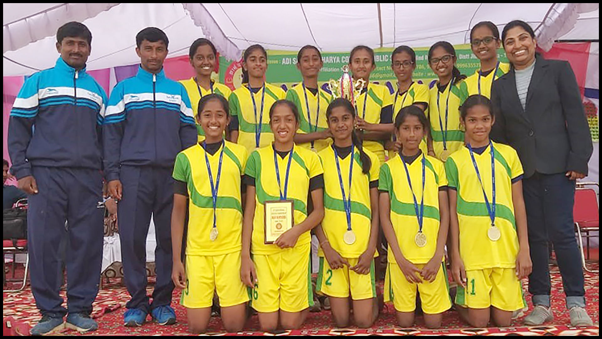 Bottom row: Amoolya M, Kripa VS, Laasya Suresh, Akshara Manohar, Vachana Basavaraj Hiremath. Top row: Chandana R, Komal B, Shreya G, Varsha G (capt.), Veditha K, Aditi Hulmani, Raksha P. Team Coach: Ranganatha VN, Thippeswamy RN. Team Manager: Anita Rai B