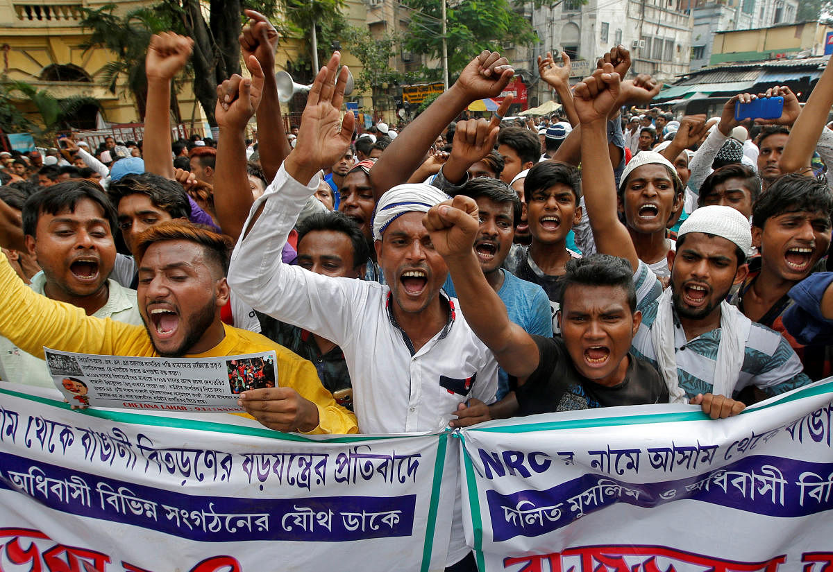 People shout slogans during a protest against what they say is the draft list of the National Register of Citizens (NRC) in the northeastern state of Assam. Reuters file photo