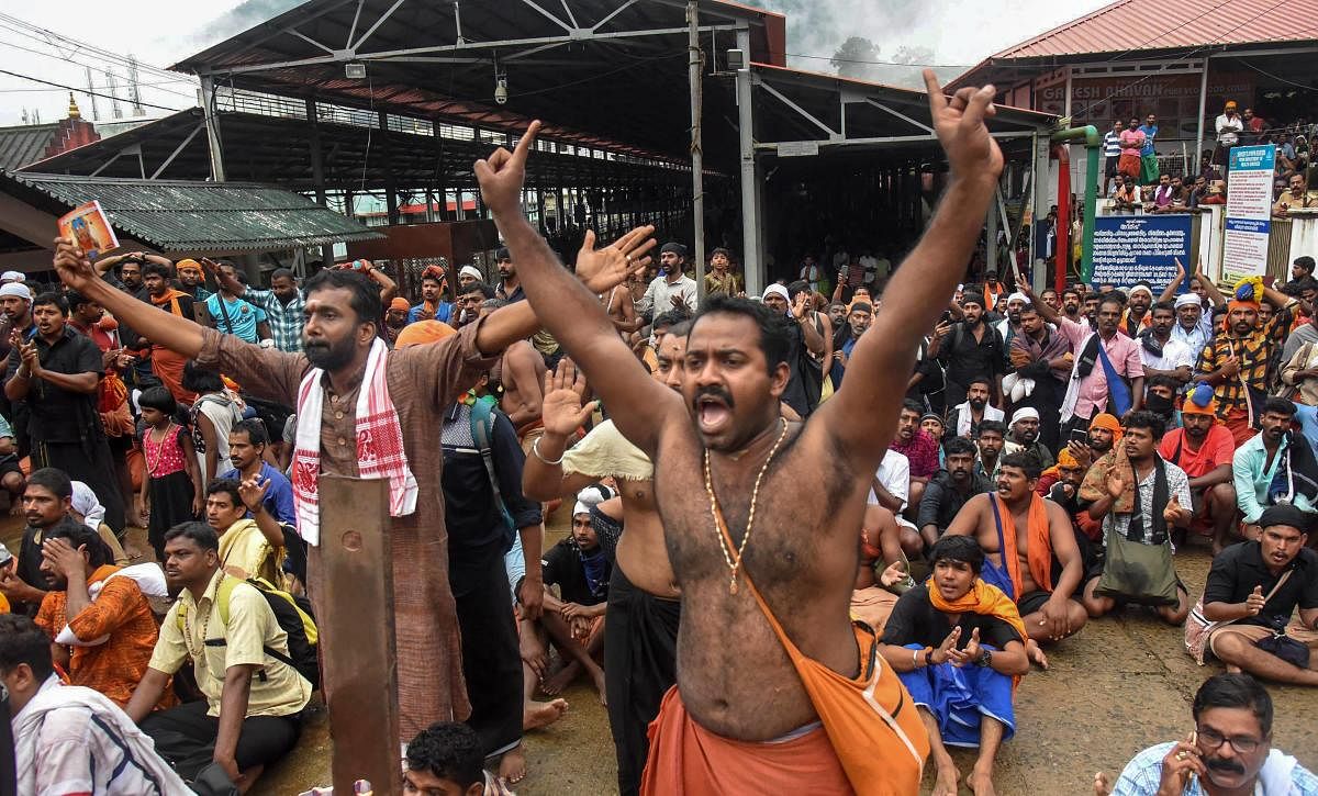 Protesters oppose the entry of women to the Sabarimala Temple on Friday. PTI