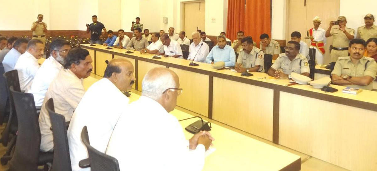 Officials take part in a preparatory meeting on Tipu Jayanti in Madikeri on Monday. DH photo