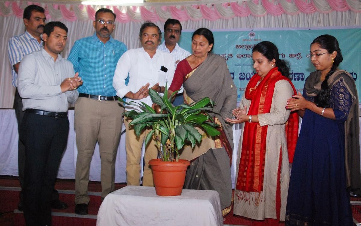 City Municipal Council president Kaveramma Somanna inaugurates Tipu Jayanti programme by watering a plant in Madikeri on Saturday.