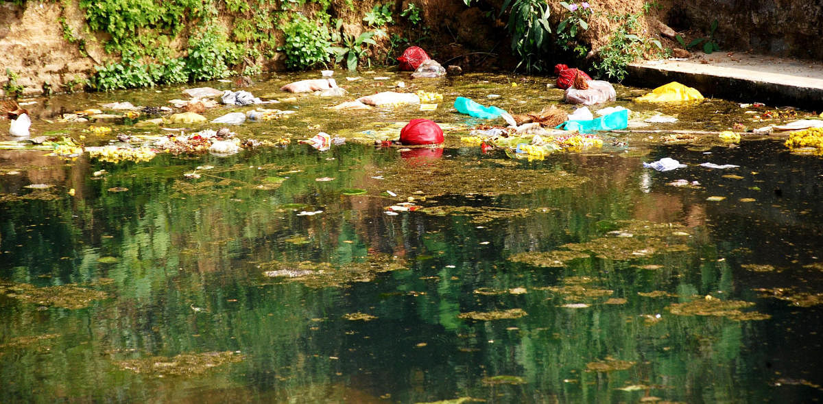 Trash dumped in Gowrikere near Omkareshwara temple in Madikeri.