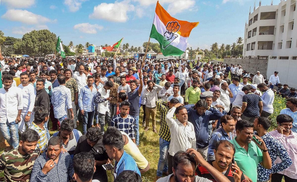 Congress party workers celebrate their win in Karnataka Urban Local Body Election 2018, in Mysuru on Wednesday, Sept 3, 2018. (PTI Photo) 
