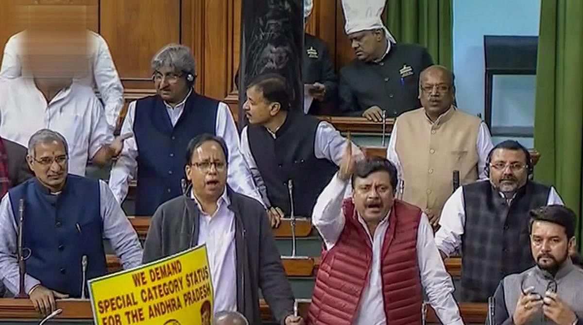 BJP members react on the Supreme Court's verdict on Rafale issue, in the Lok Sabha during the Winter Session of Parliament, New Delhi, Friday, Dec 14, 2018. (LSTV GRAB via PTI