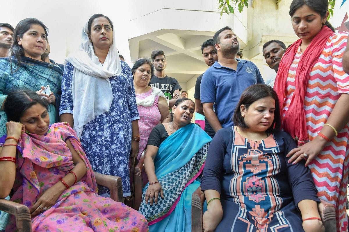 Family members of Vivek Tiwari. (PTI File Photo)