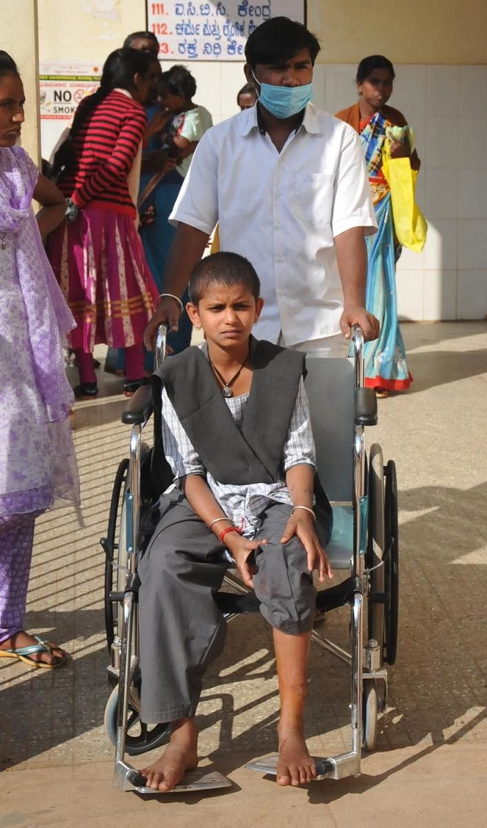 Rakshitha, a student who was bitten by a stray dog, was shifted to the hospital in a wheelchair.