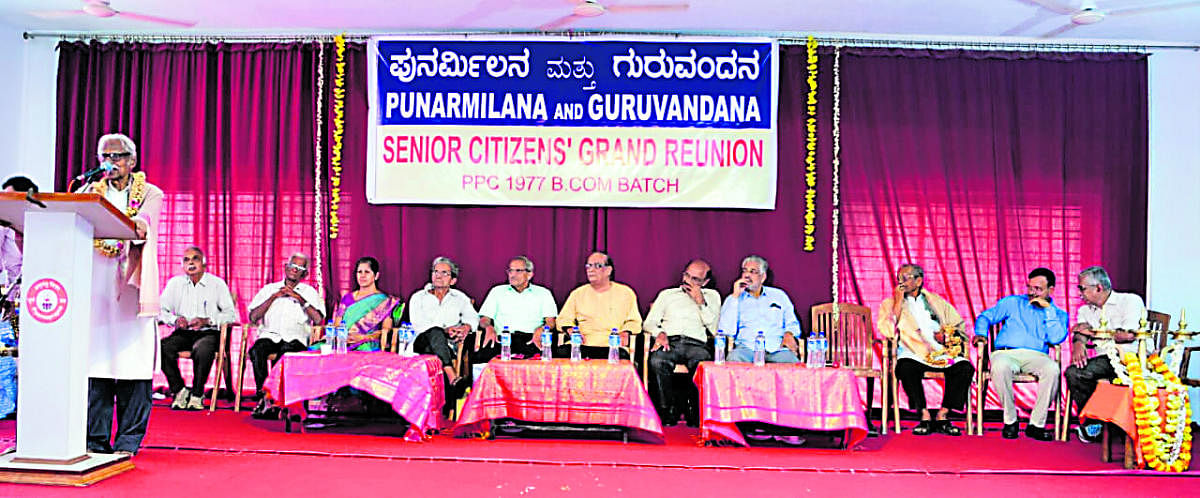 Retired lecturer of Poornaprajna College Udyavara Madhava Acharya speaks during the reunion of 1977 batch BCom students in Udupi.