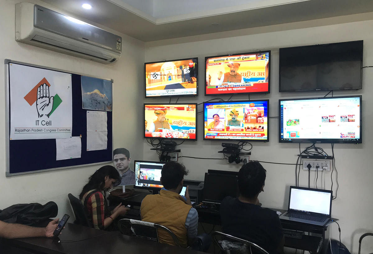 Volunteers of India's main opposition Congress party monitor TV news channels and social media inside their war room which was setup for a state assembly election, in Jaipur in the desert state of Rajasthan. Picture taken on December 3, 2018. (REUTERS/Aditya Kalra)