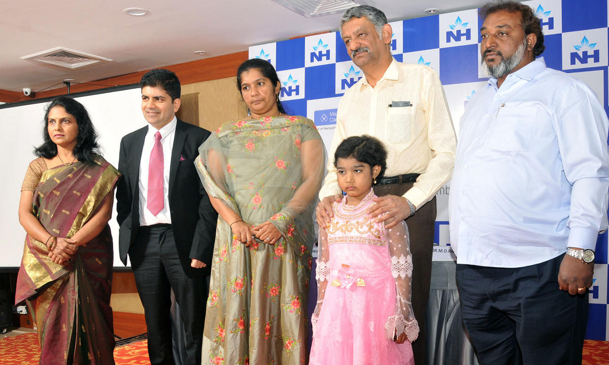 Syeda and her father seen with doctors, in Mysuru, on Thursday.