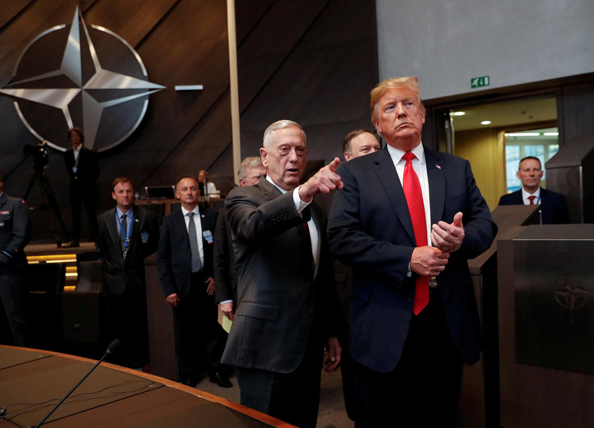 U.S. President Donald Trump walks in with U.S. Defense Secretary Jim Mattis. Reuters file photo