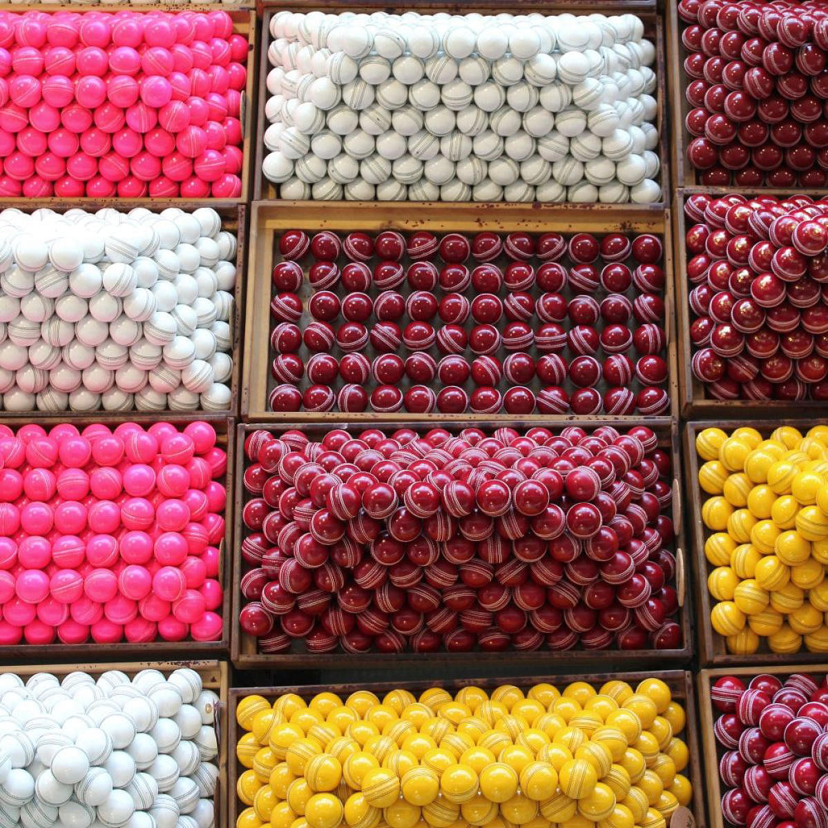 Balls used for different types of matches are exhibited after they have undergone the final stages of production and testing. (Photo: Kookaburra website)