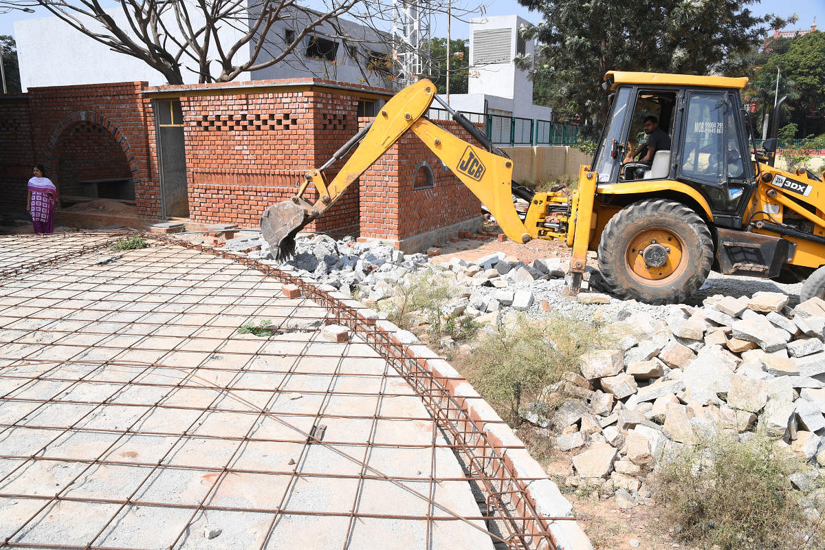 Rangamandira which is under construction at GAS college campus was being demolished by the GAS college authorities on Govt. direction in Bengaluru on Saturday. Photo: Srikanta Sharma R.
