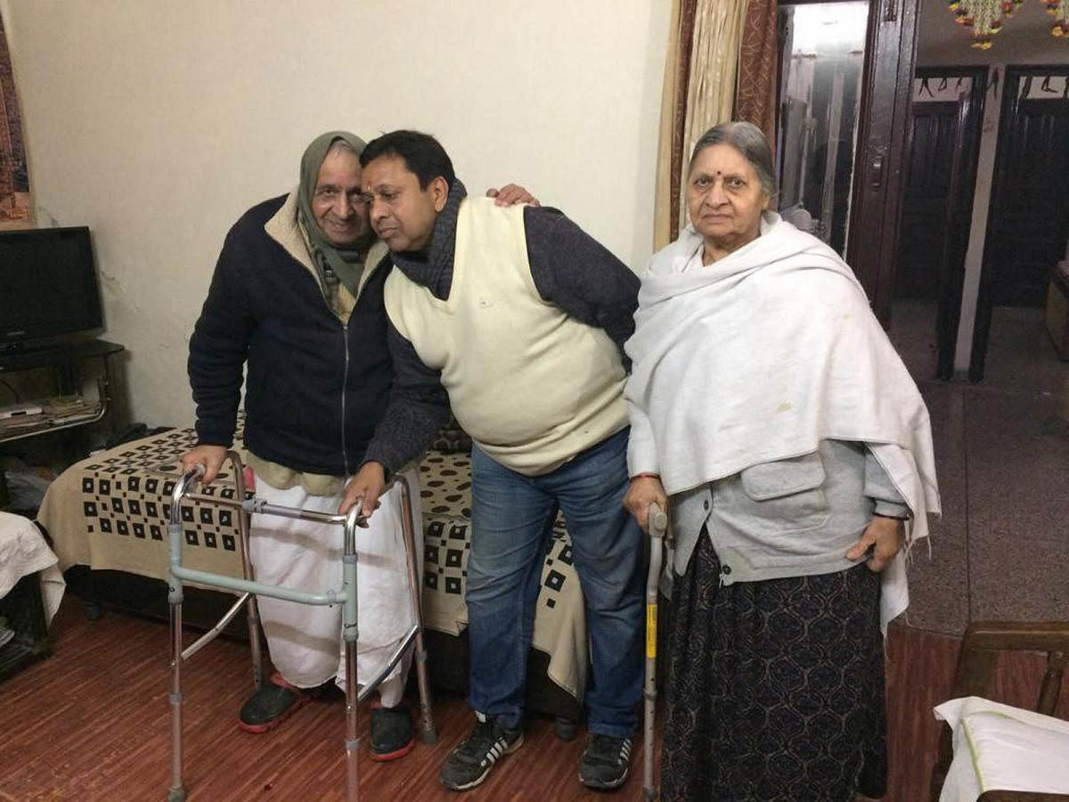 Sushil Kumar Sharma with his family members at his residence in New Delhi. (PTI Photo)