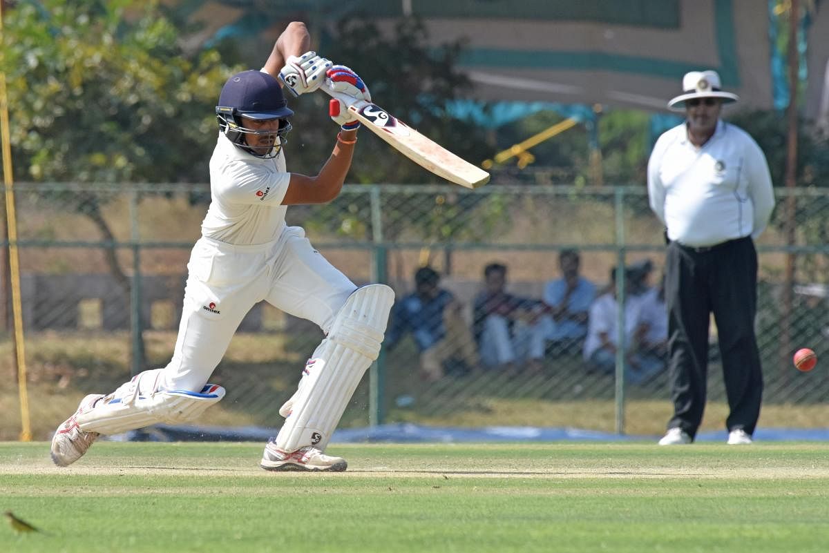 SOLID: Karnataka's D Nishcal en route to his century in the Ranji Trophy game against Railways in Shivamogga on Monday. DH photo/ S K Dinesh
