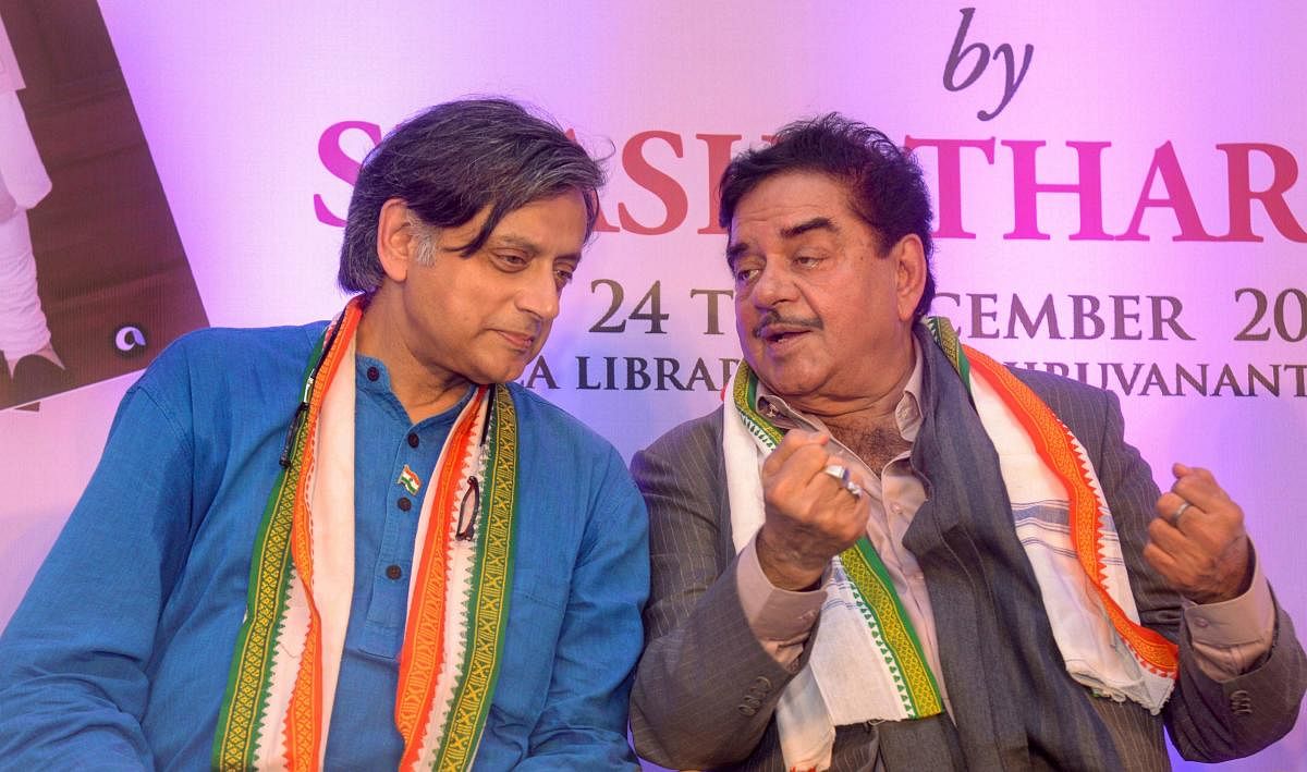 BJP MP Shatrughan Sinha and Congress leader Shashi Tharoor during the release of his book 'The Paradoxical Prime Minister', in Thiruvananthapuram, Monday, Dec. 24, 2018. (PTI Photo)