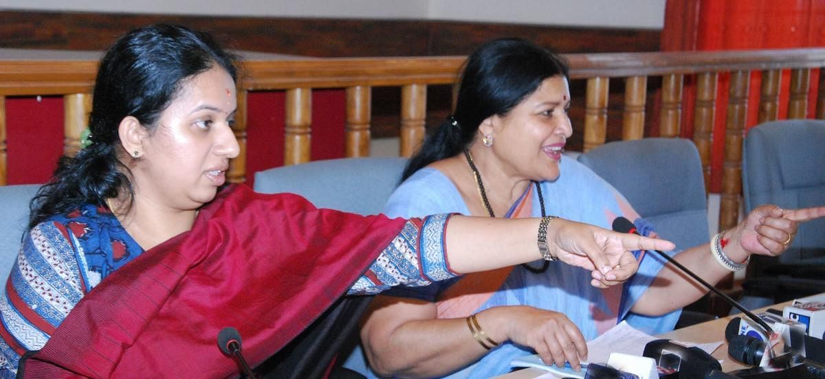 Women and Child Welfare and Kannada and Culture Department Minister Jayamala speaks during the progress review meeting at the DC's office in Madikeri on Monday. Deputy Commissioner P I Sreevidya is also seen.