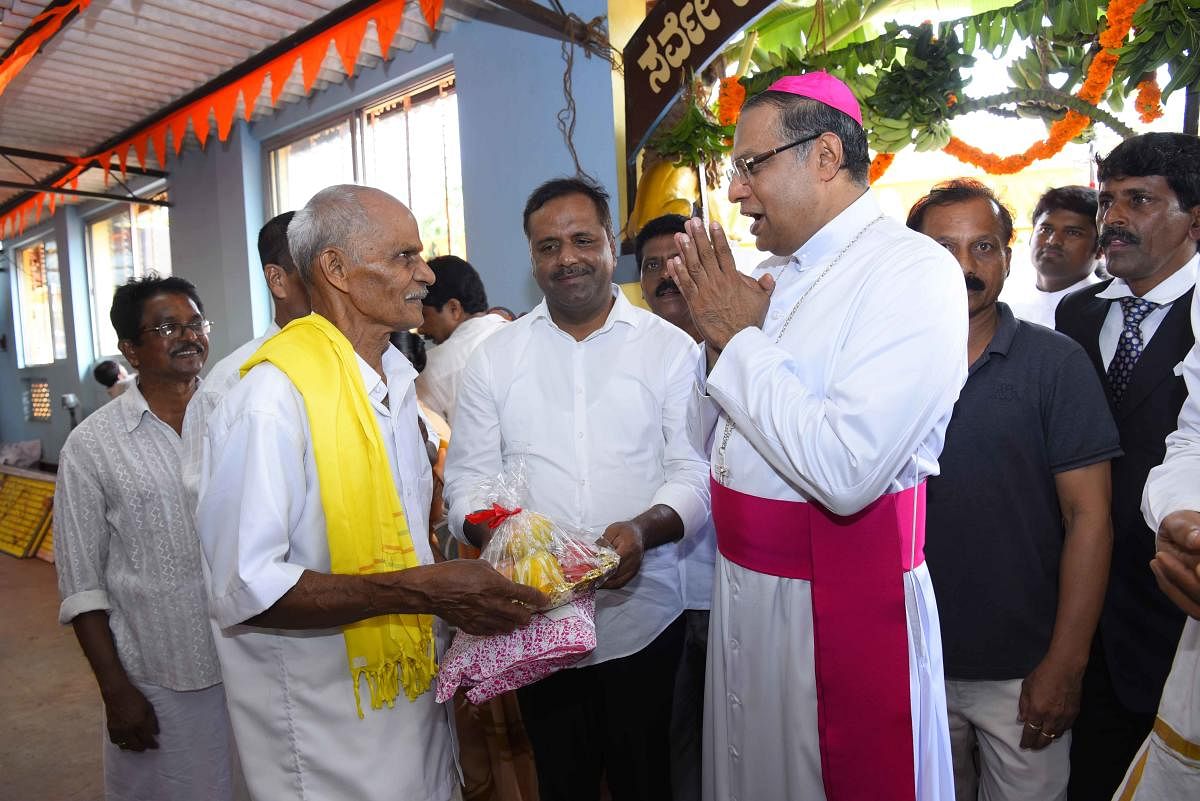 Mangaluru Diocese Bishop Rev Dr Peter Paul Saldanha wishes people at the Vitoba Rukmai Mandira, Permannuru, on the outskirts of Mangaluru for Christmas on Tuesday.