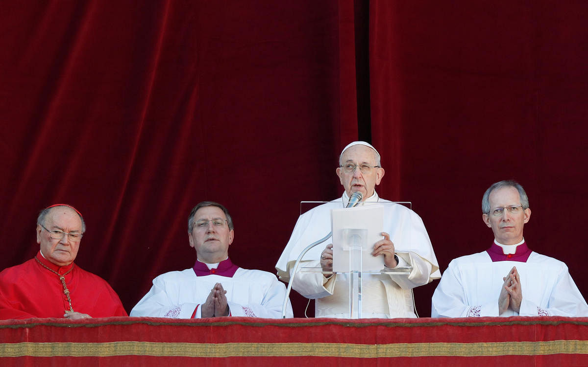 Pope Francis delivers the "Urbi et Orbi" message from the main balcony of Saint Peter's Basilica at the Vatican. Reuters