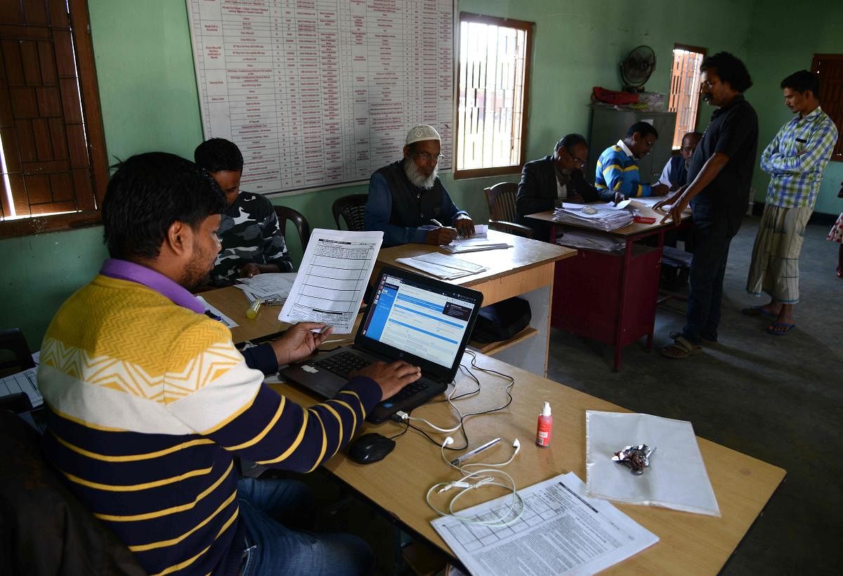 Employees of the National Register of Citizens (NRC) work in an NRC centre at Hatisola village in Kamrup district, Assam. (AFP File Photo)