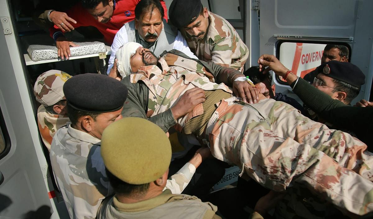 An ITBP jawan who was injured in a road accident being shifted to a hospital in Jammu, Monday, Dec. 24, 2018 (PTI Photo)