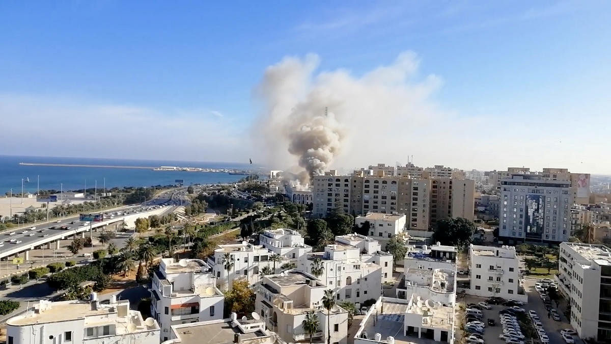 Smoke rises from the Libyan foreign ministry building in Tripoli, Libya December 25, 2018, in this still image obtained from a social media video. (Youtube/Mohammed Elgotani/via REUTERS)